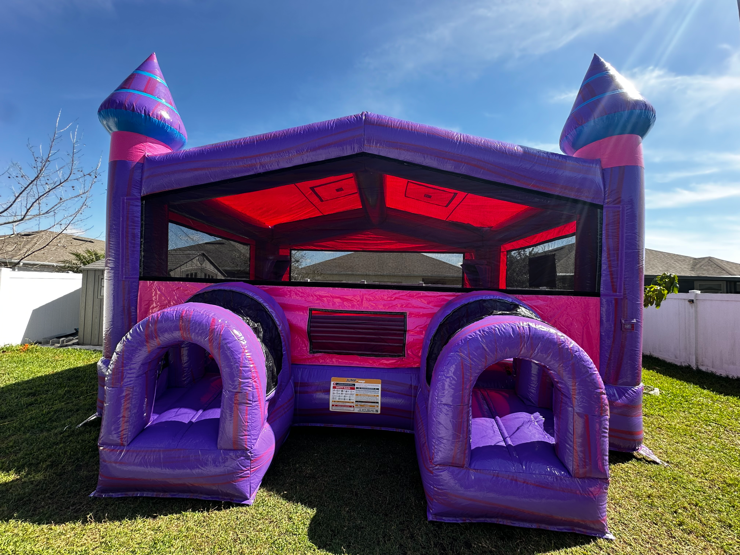 Front of Mia XL Purple Palace showing twin purple entry tunnels and wide mesh jumping area