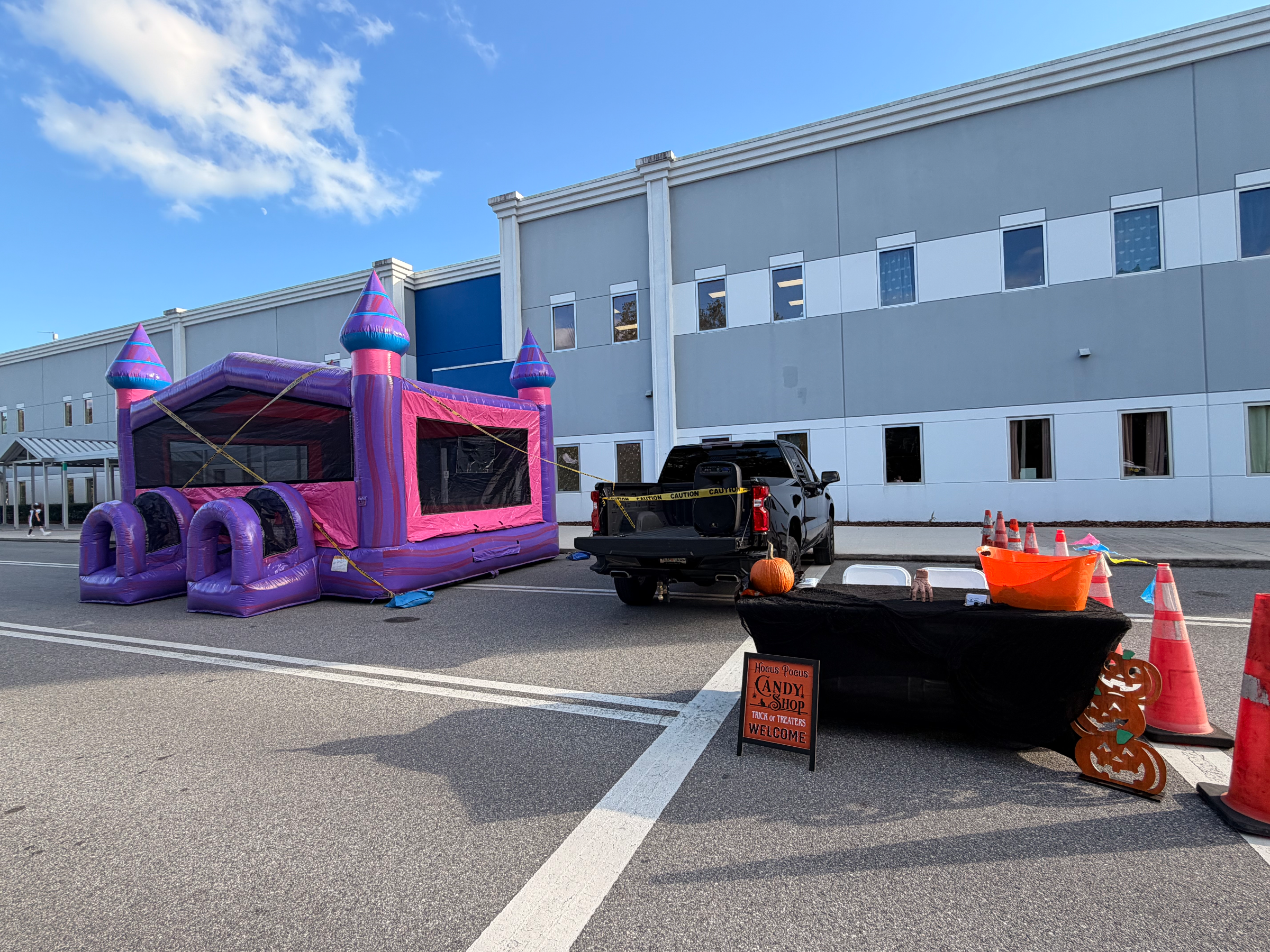 Mia XL Purple Palace outside a building with purple towers and pink mesh frames